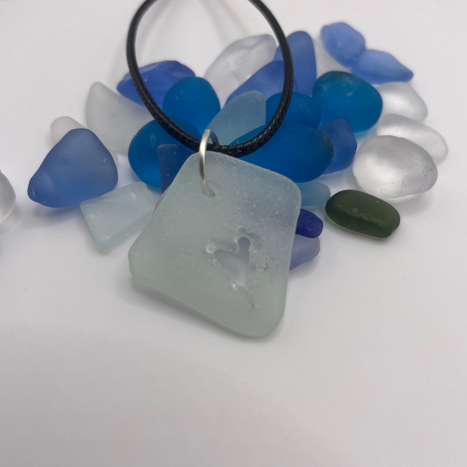 carved sea glass pendant