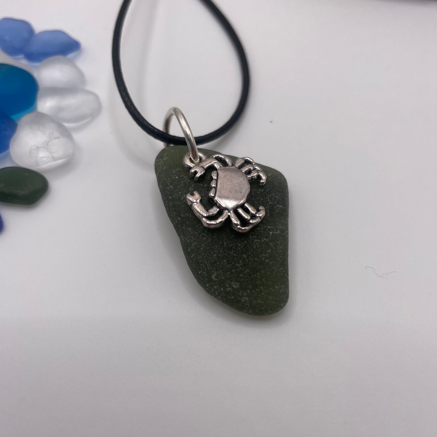 carved sea glass pendant