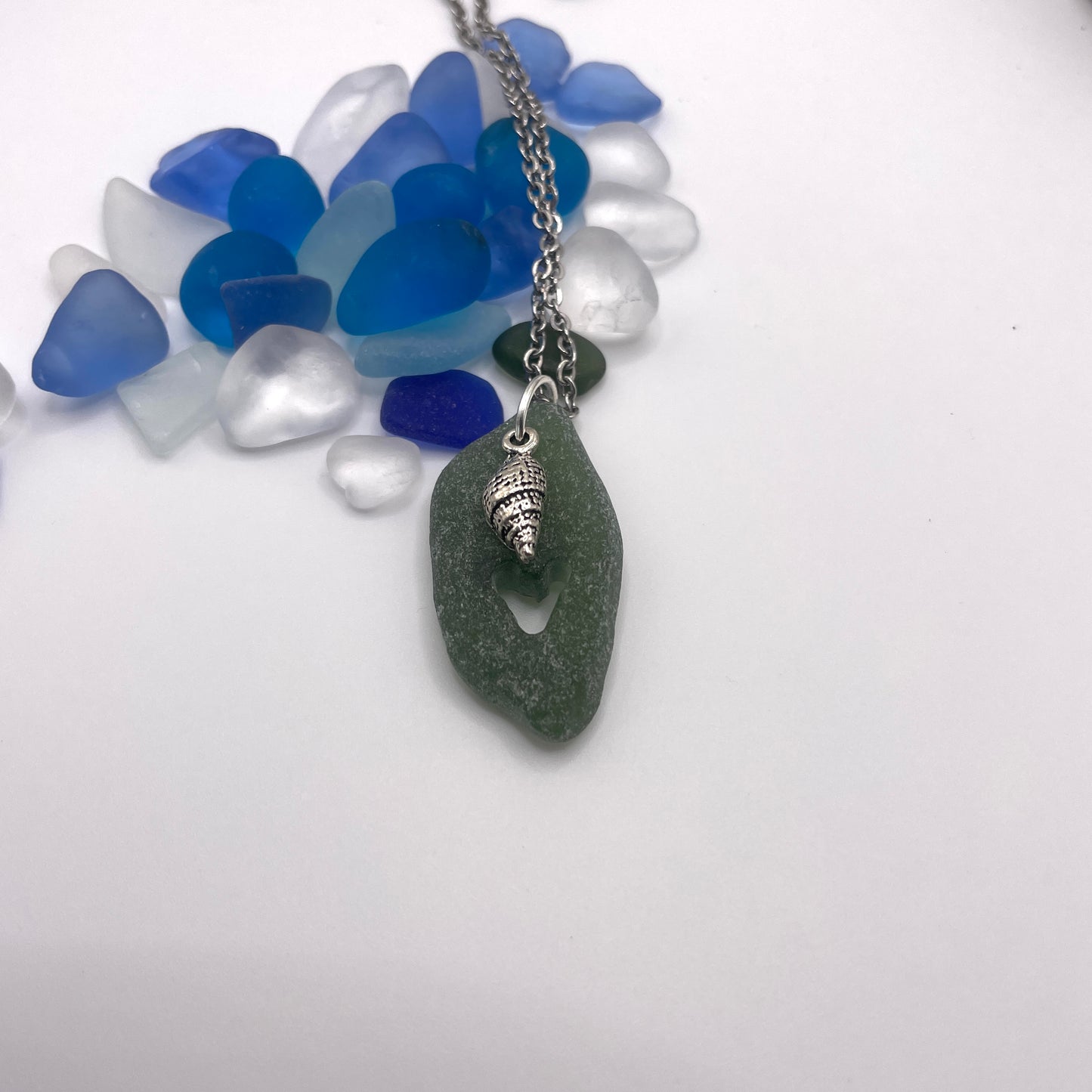 carved sea glass pendant