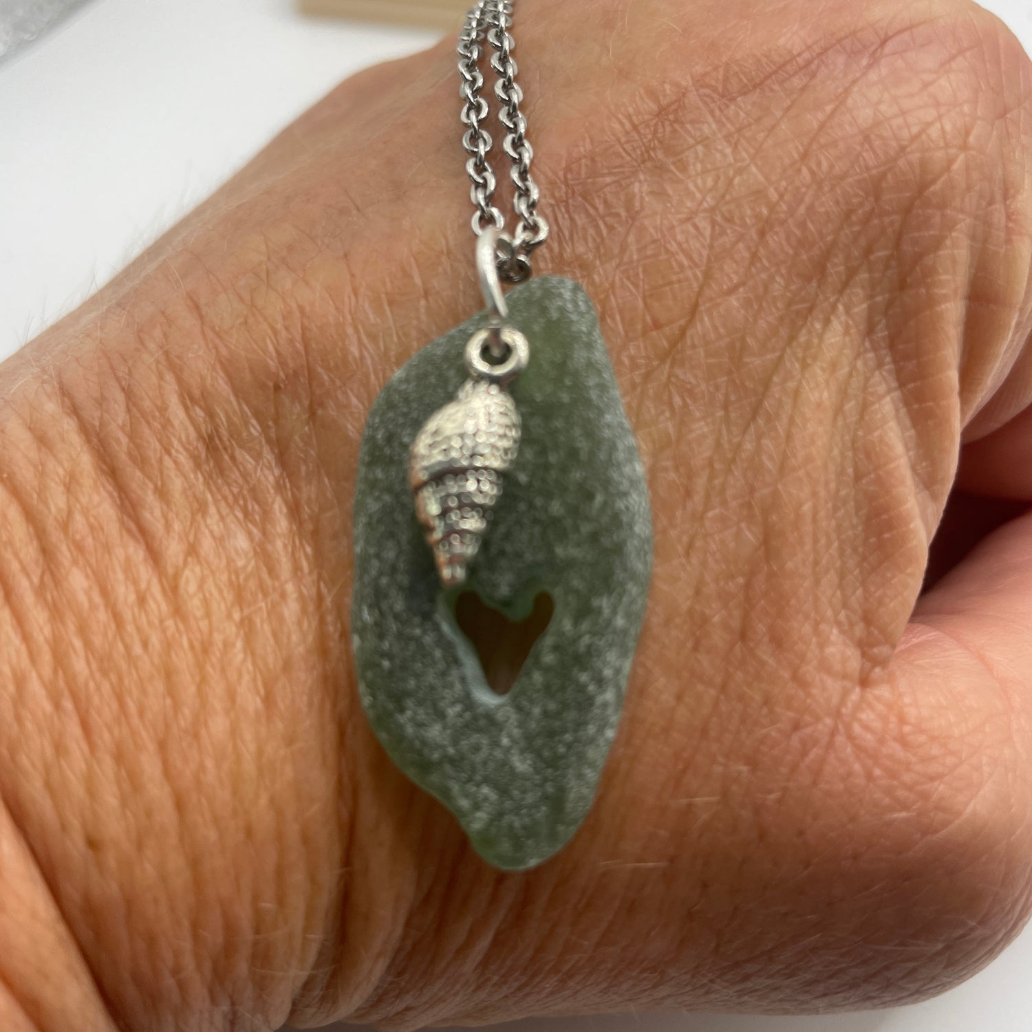 carved sea glass pendant